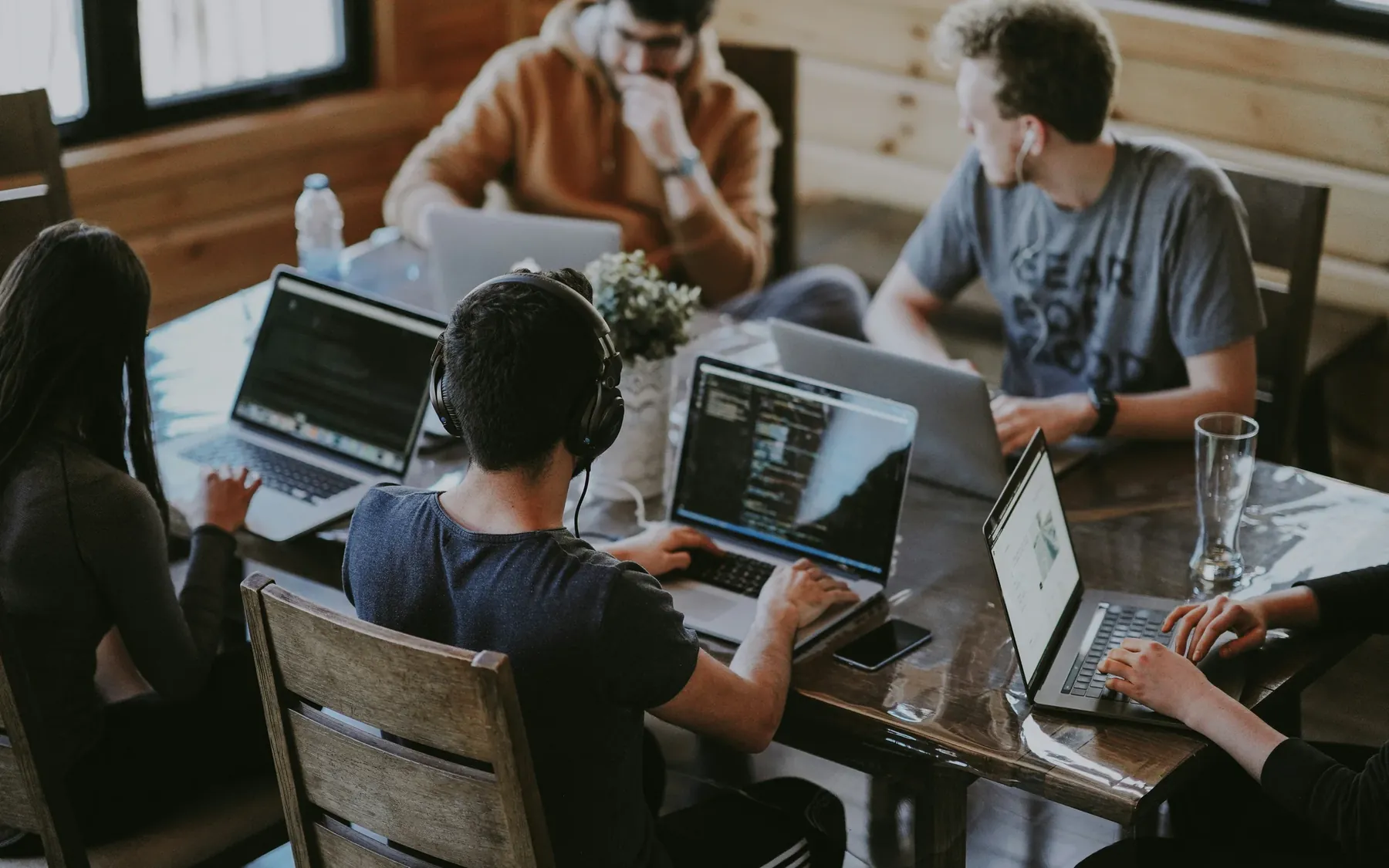 A diverse business and technology team working together around a table